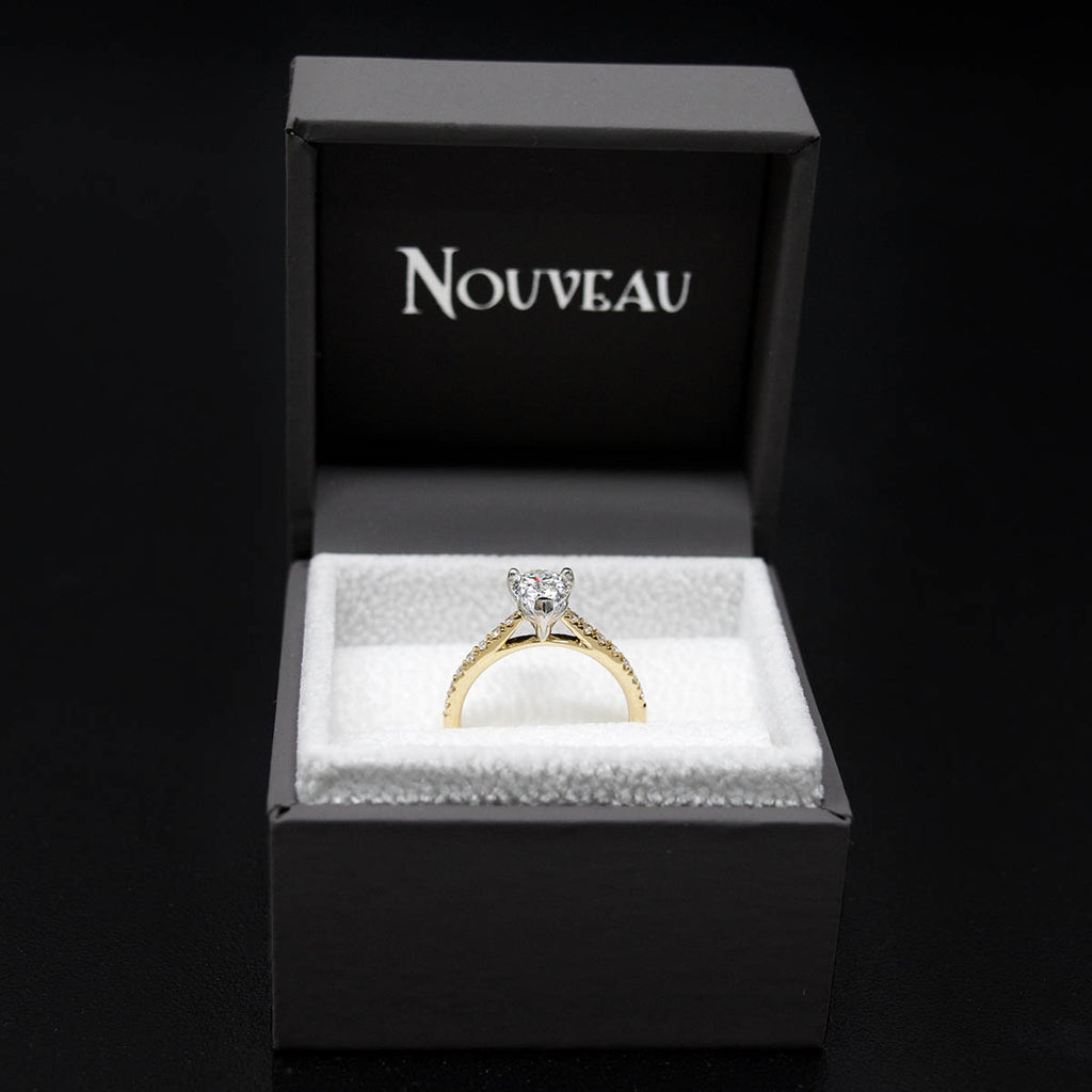 18ct Gold Pear Shaped Halo Diamond Engagement Ring in box, sold at Nouveau Jewellers in Manchester