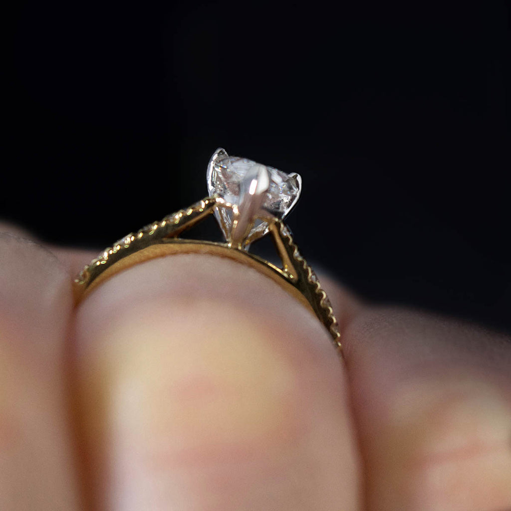 18ct Gold Pear Shaped Halo Diamond Engagement Ring on finger, sold at Nouveau Jewellers in Manchester