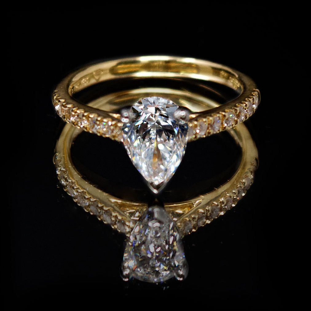 18ct Gold Pear Shaped Halo Diamond Engagement Ring, sold at Nouveau Jewellers in Manchester