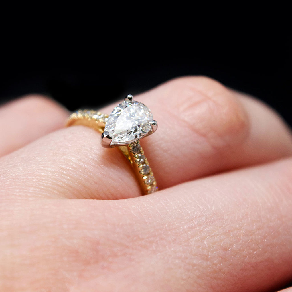 18ct Gold Pear Shaped Halo Diamond Engagement Ring on hand, sold at Nouveau Jewellers in Manchester