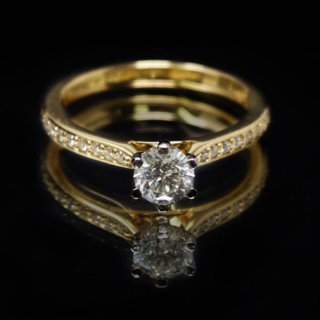 18ct Yellow Gold Solitaire Diamond Engagement Ring with Diamond Shoulders, sold at Nouveau Jewellers in Manchester