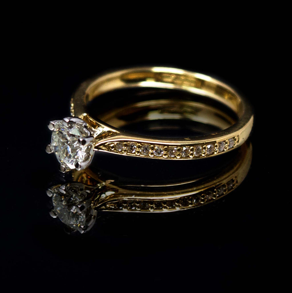 18ct Yellow Gold Solitaire Diamond Engagement Ring with Diamond Shoulders side profile, sold at Nouveau Jewellers in Manchester