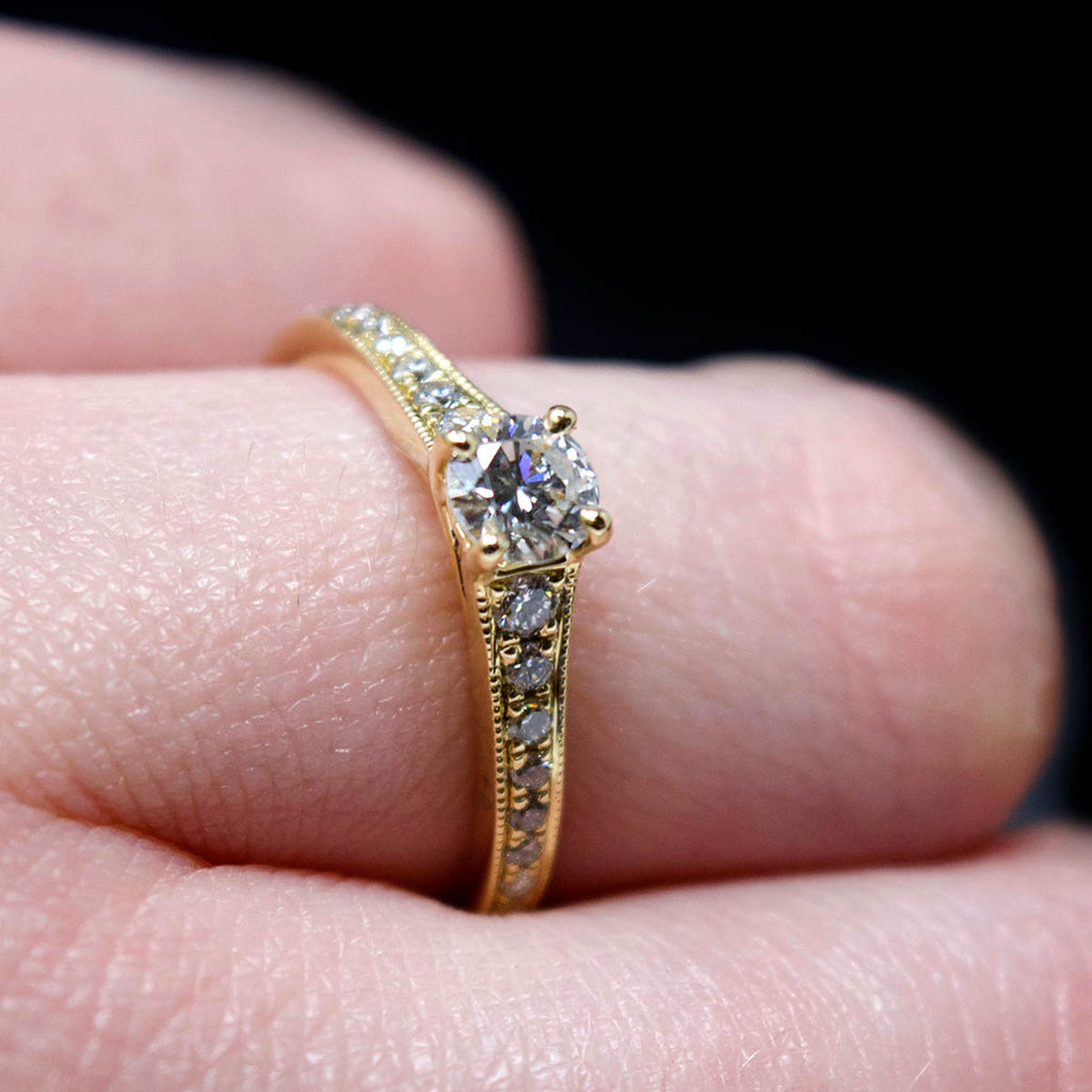 18ct Yellow Gold Vintage Solitaire Diamond Cluster Engagement Ring side profile on finger, sold at Nouveau Jewellers in Manchester