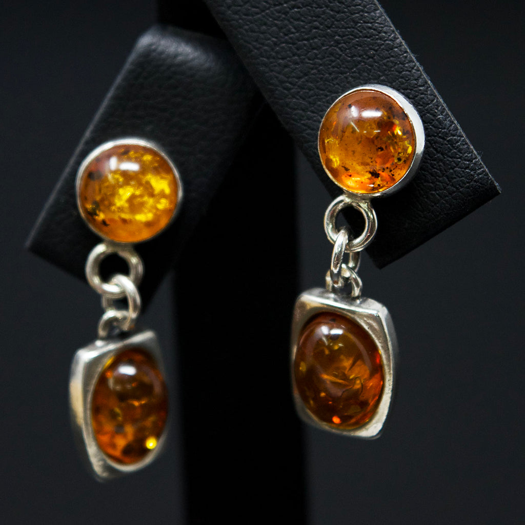 Silver Amber Pendant Earrings close up, sold at Nouveau Jewellers in Manchester