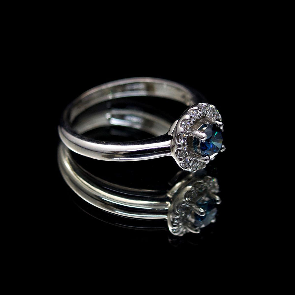 18ct White Gold Blue Diamond Halo Engagement Ring side profile, sold at Nouveau Jewellers in Manchester