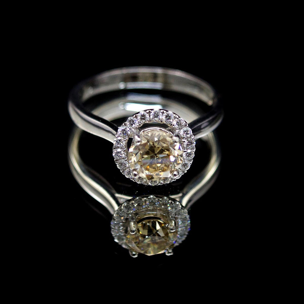 Platinum Halo Yellow Diamond Engagement Ring, sold at Nouveau Jewellers in Manchester