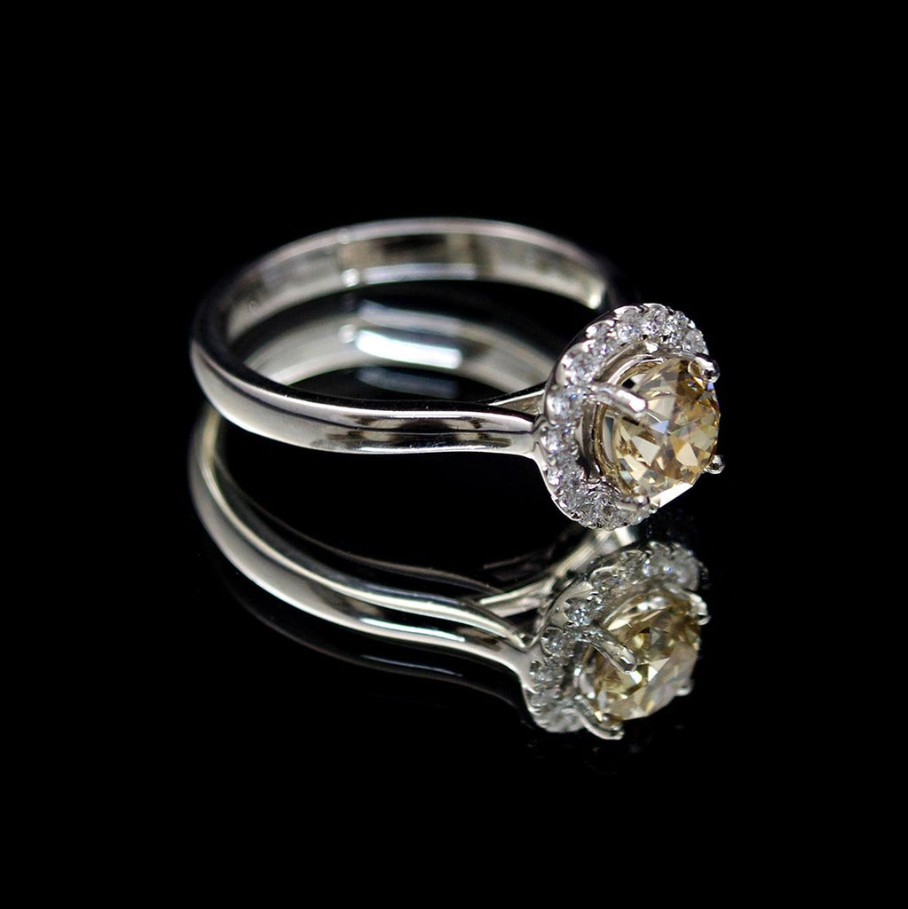 Platinum Halo Yellow Diamond Engagement Ring side profile, sold at Nouveau Jewellers in Manchester