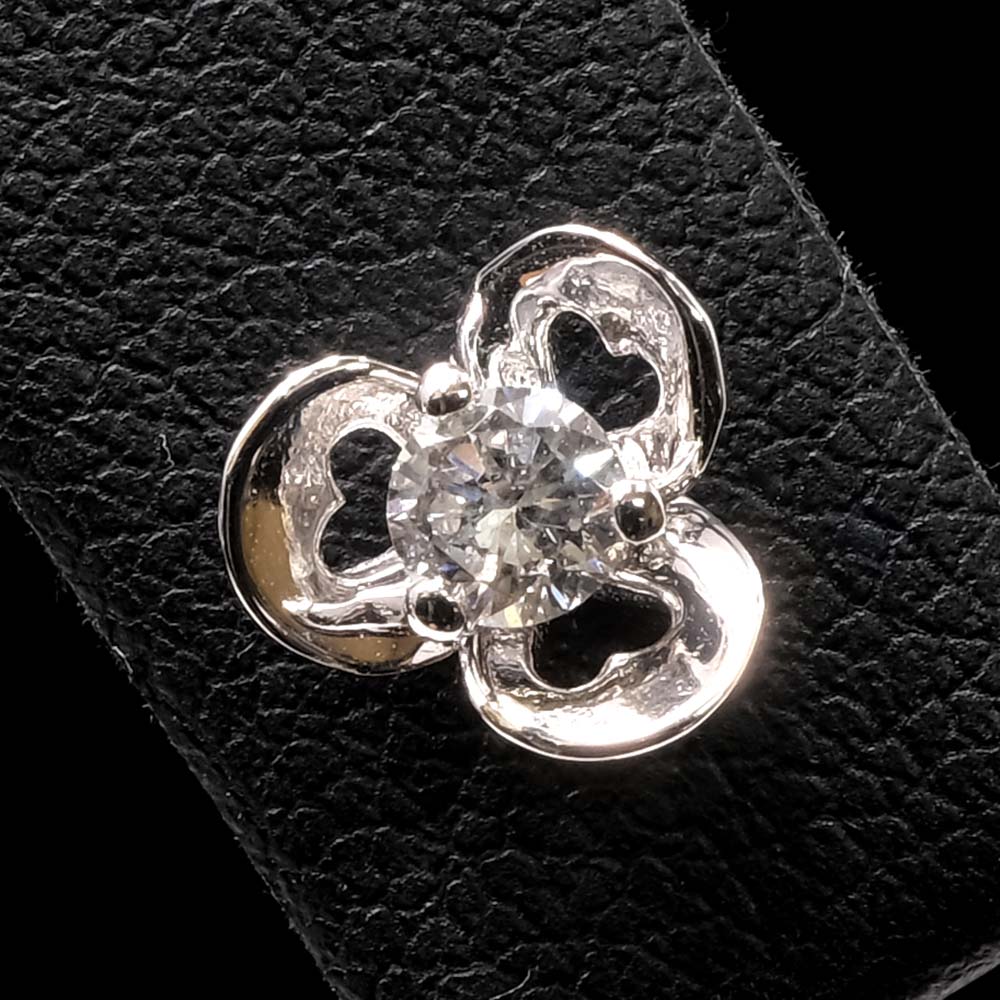 Gold Contemporary Diamond Flower Stud Earrings close up of one, sold at Nouveau Jewellers in Manchester