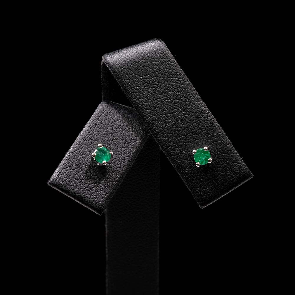 White Gold Minimal Emerald Stud Earrings Close Up, sold at Nouveau Jewellers in Manchester