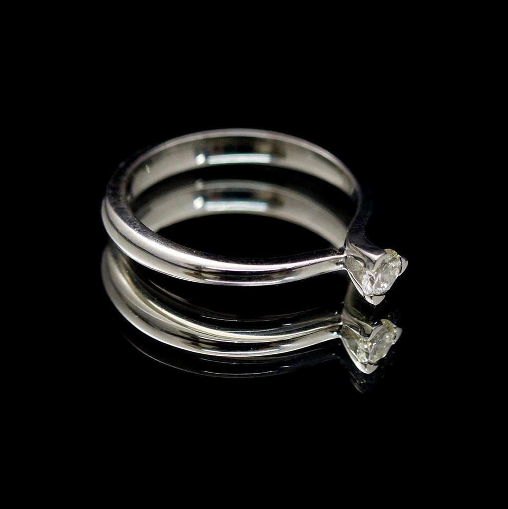 Platinum Twisted Design Solitaire Diamond Engagement Ring side profile, sold at Nouveau Jewellers in Manchester