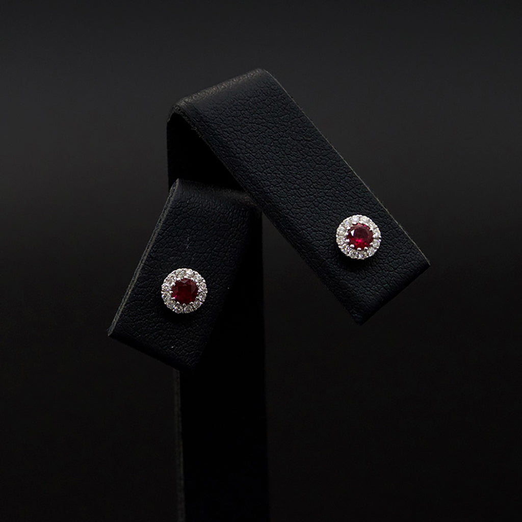 18ct White Oval Ruby and Diamond Stud Earrings close up, sold at Nouveau Jewellers in Manchester