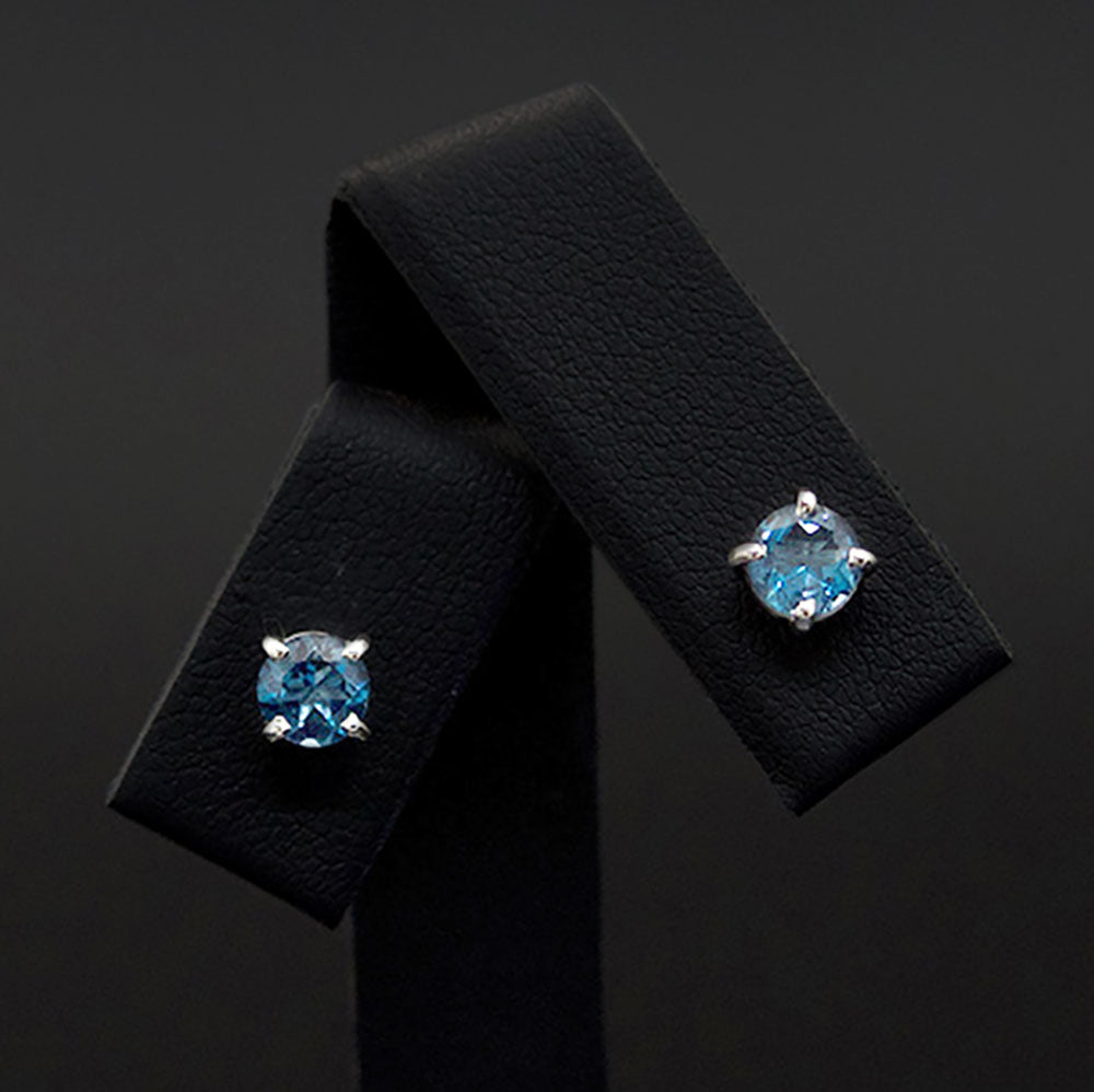18ct White Gold London Blue Topaz studs close up, sold at Nouveau Jewellers in Manchester