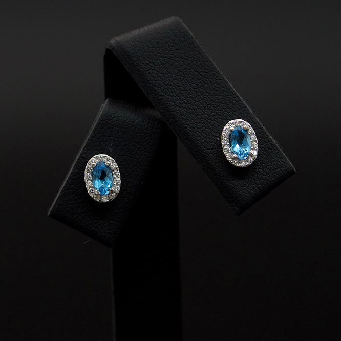 18ct White Gold London Blue Topaz and Diamond studs close up, sold at Nouveau Jewellers in Manchester