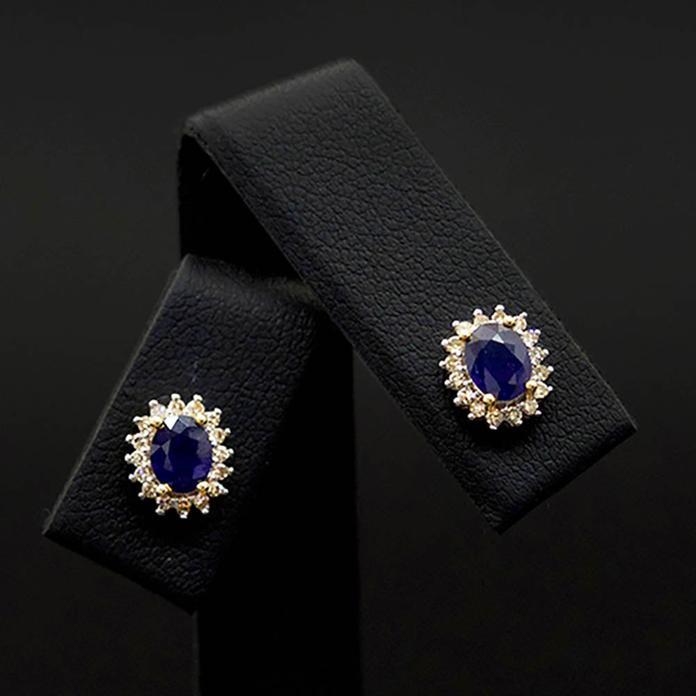 9ct Gold Sapphire and Diamond Halo Stud Earrings close up, sold at Nouveau Jewellers in Manchester