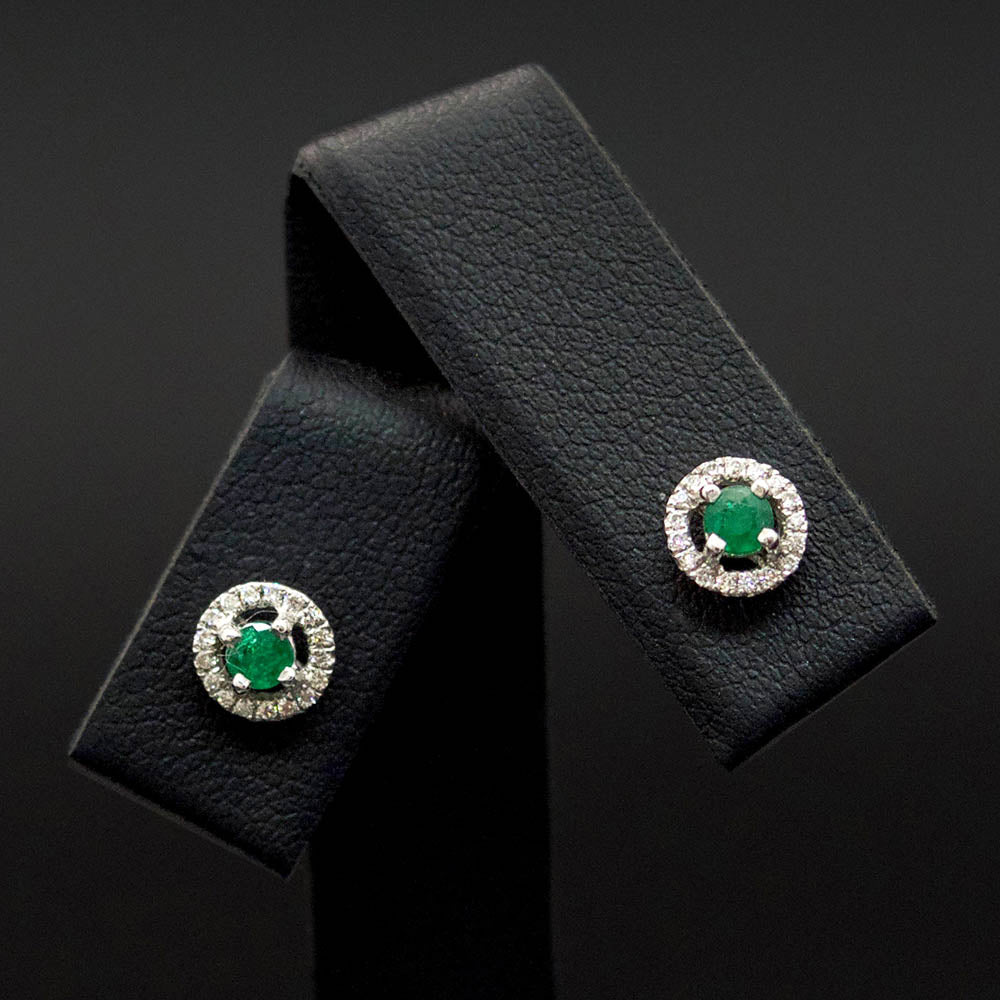 18ct White Gold Emerald and Diamond Halo Stud Earrings close up, sold at Nouveau Jewellers in Manchester