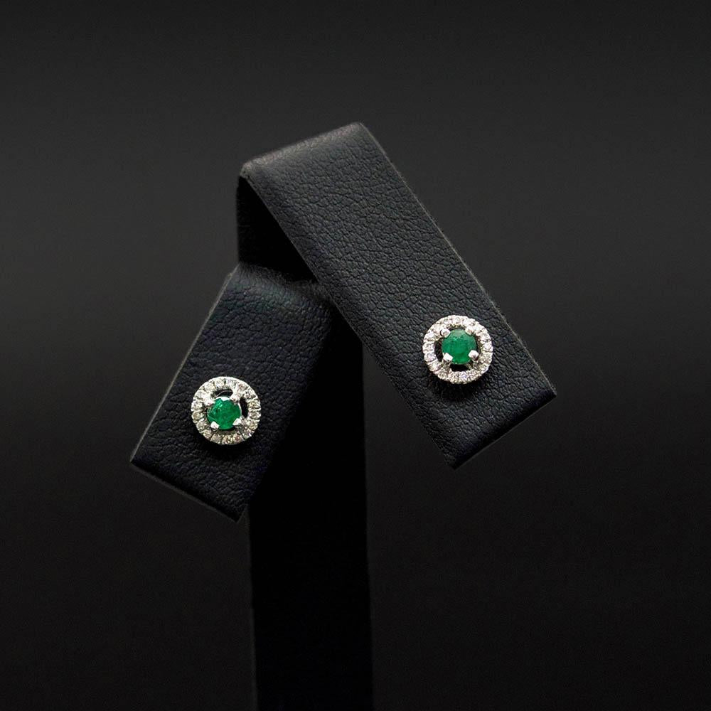 18ct White Gold Emerald and Diamond Halo Stud Earrings, sold at Nouveau Jewellers in Manchester