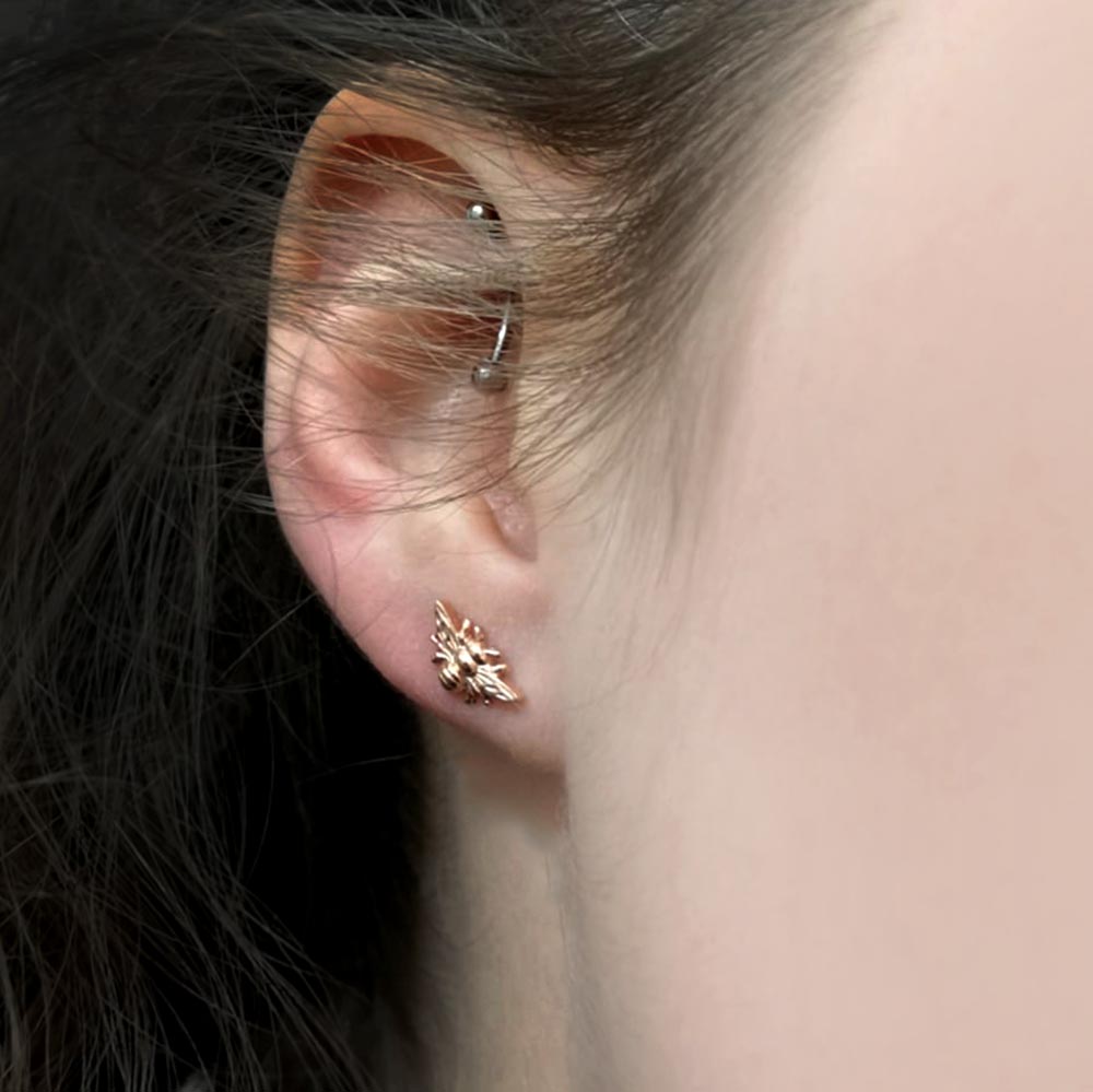Rose Gold Manchester Bee Studs in girls ear, Beehive Collection exclusively sold at Nouveau Jewellers in Manchester