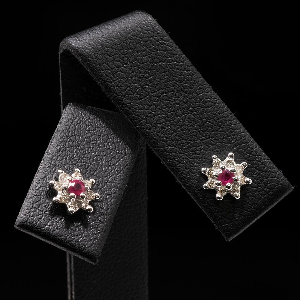 Gold Ruby and Diamond Stud Earrings close up, sold at Nouveau Jewellers in Manchester